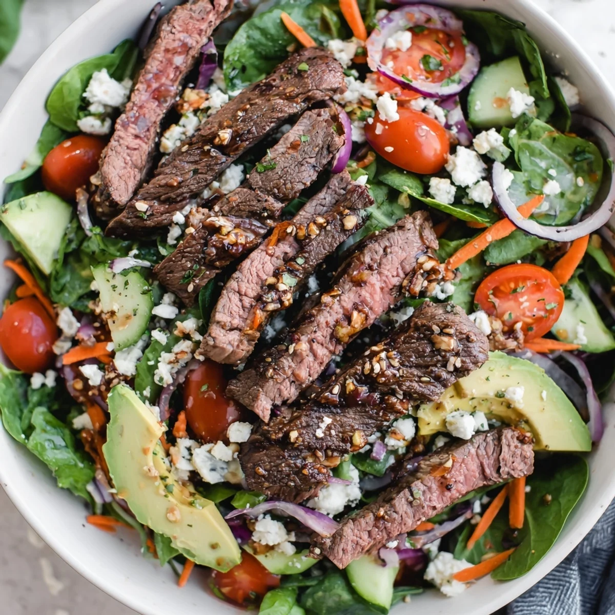 Crisp romaine and julienned carrots support tender beef slices and creamy avocado slices in this vibrant Beef Salad Bowl.