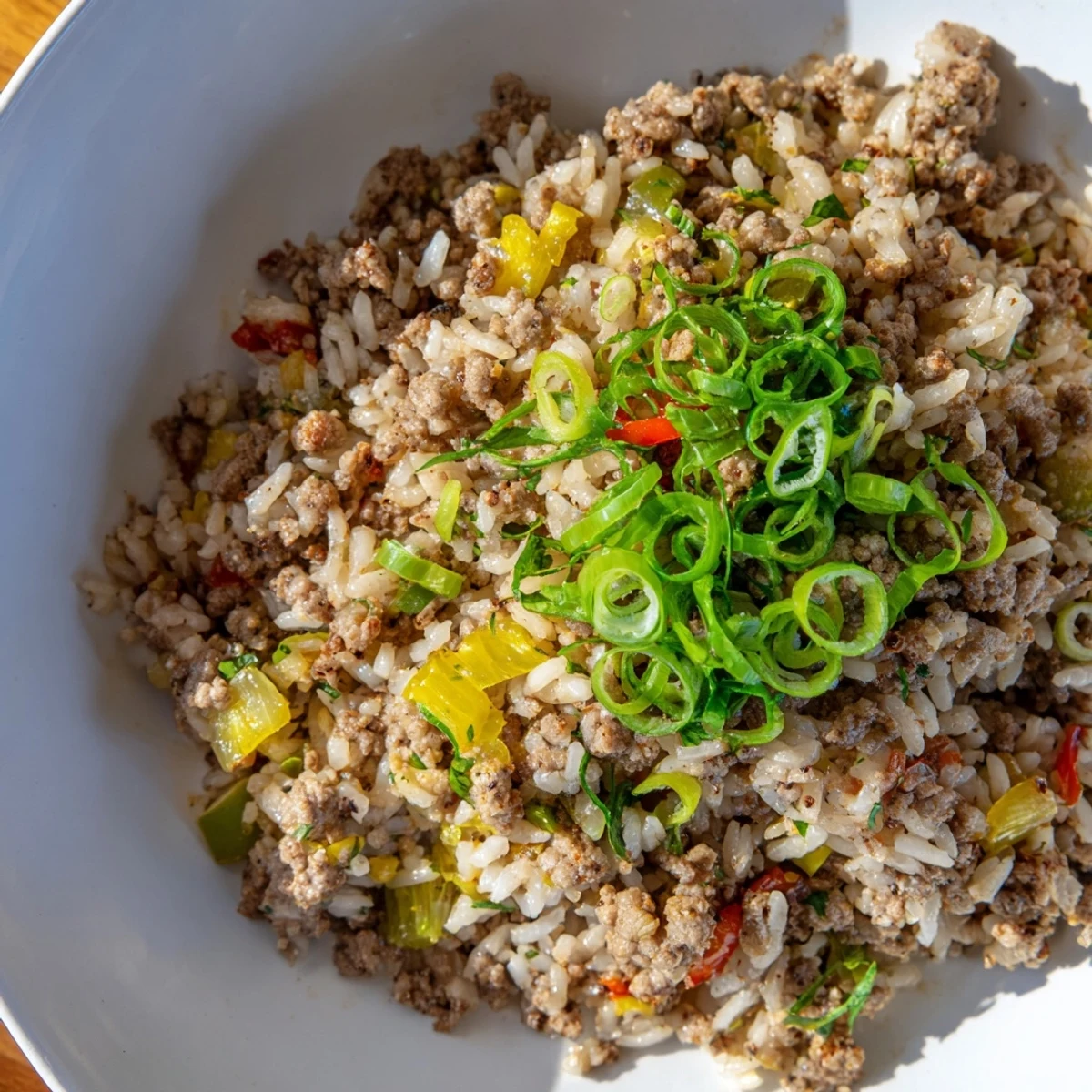 A close-up of Cajun Dirty Rice with Ground Turkey highlights sautéed vegetables, cajun spices, and tender rice grains for a family dinner.