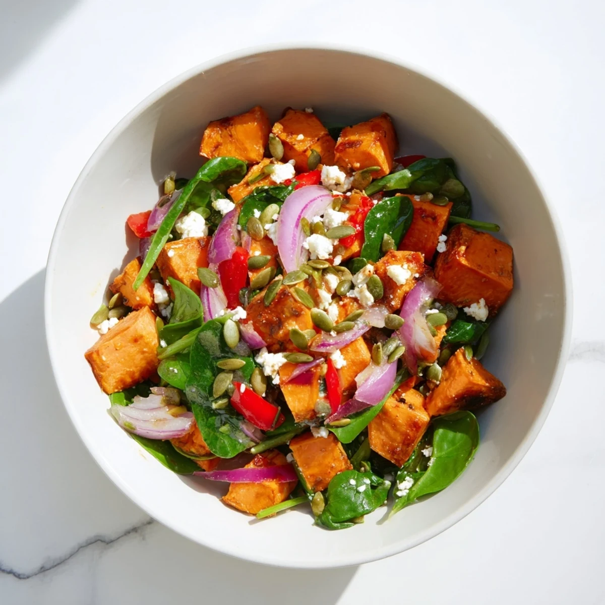 Caramelized sweet potatoes in this Roasted Sweet Potato Salad with Lime are tossed with spinach and a zesty lime dressing.