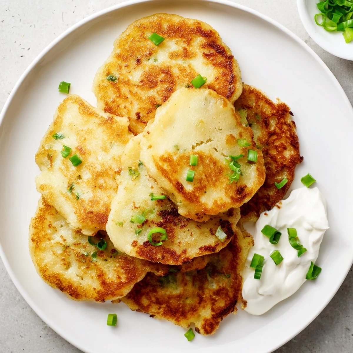 These golden Irish Boxty Potato Pancakes with Scallions are perfect as a vegetarian side dish for dinner.