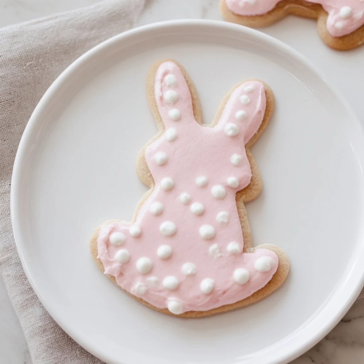 Golden-brown Easter Bunny Sugar Cookies with pastel royal icing, arranged on a cooling rack, ready for spring celebrations.