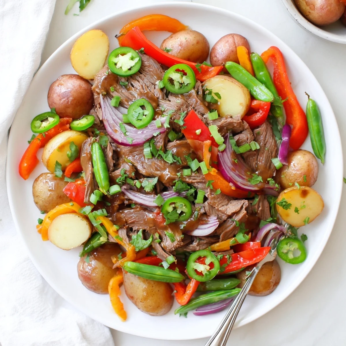 Sizzling beef and golden potatoes create a hearty, cowboy-inspired Blackstone Cowboy Stir Fry Dinner on the griddle. 