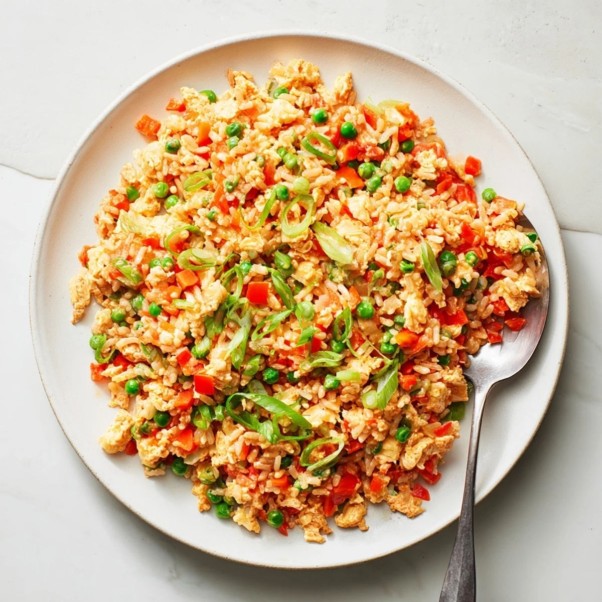Enjoy vegetarian Bang Bang Fried Rice as a quick main dish with vibrant veggies and a tangy chili kick.