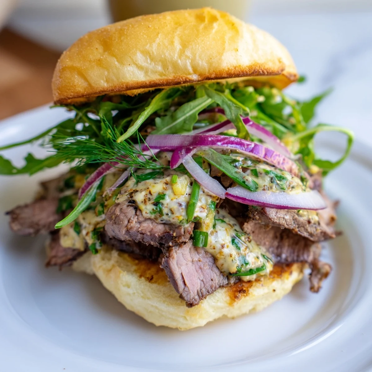 Savory Cowboy Butter Steak Sliders served with red onion on soft slider buns.