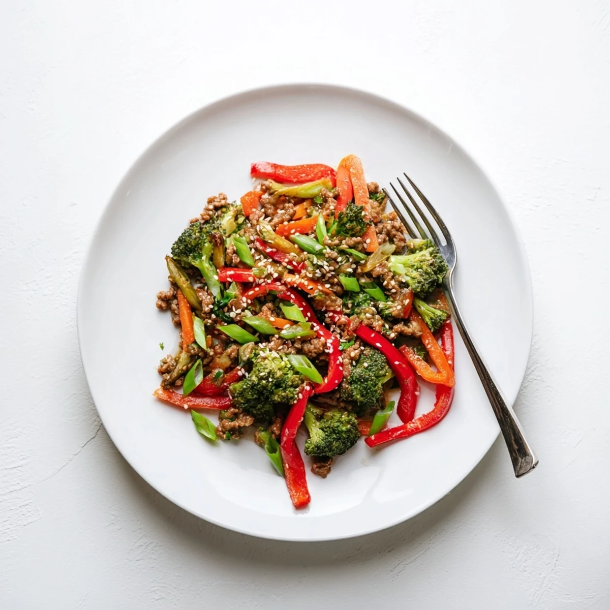 Sizzling skillet of lean ground turkey and crisp broccoli in Asian inspired stir fry