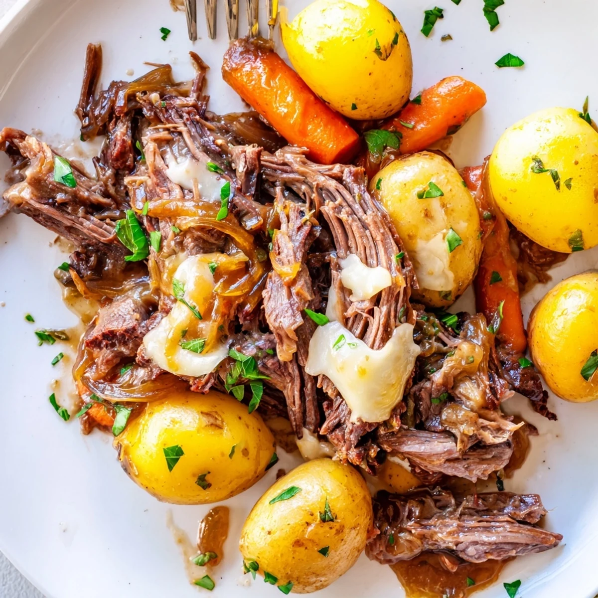 Succulent beef chuck roast slow-cooked with golden onions, carrots, and thyme-infused sauce finished with melted Gruyère cheese