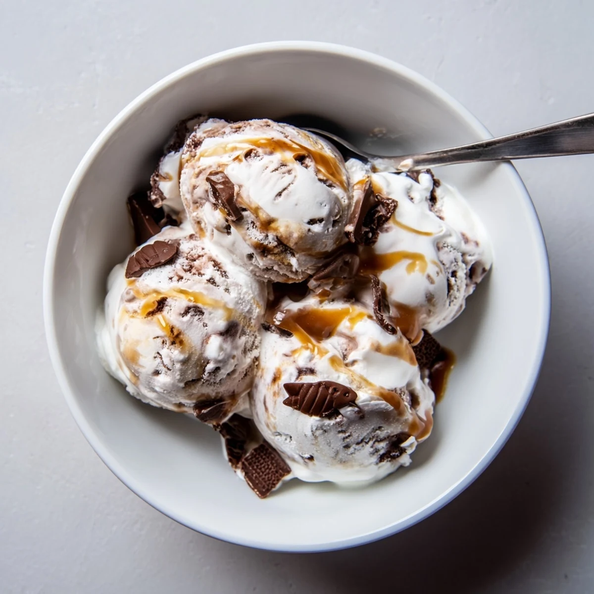 Rich Ninja Creami Phish Food dessert featuring chocolate fish swimming in caramel and marshmallow swirls