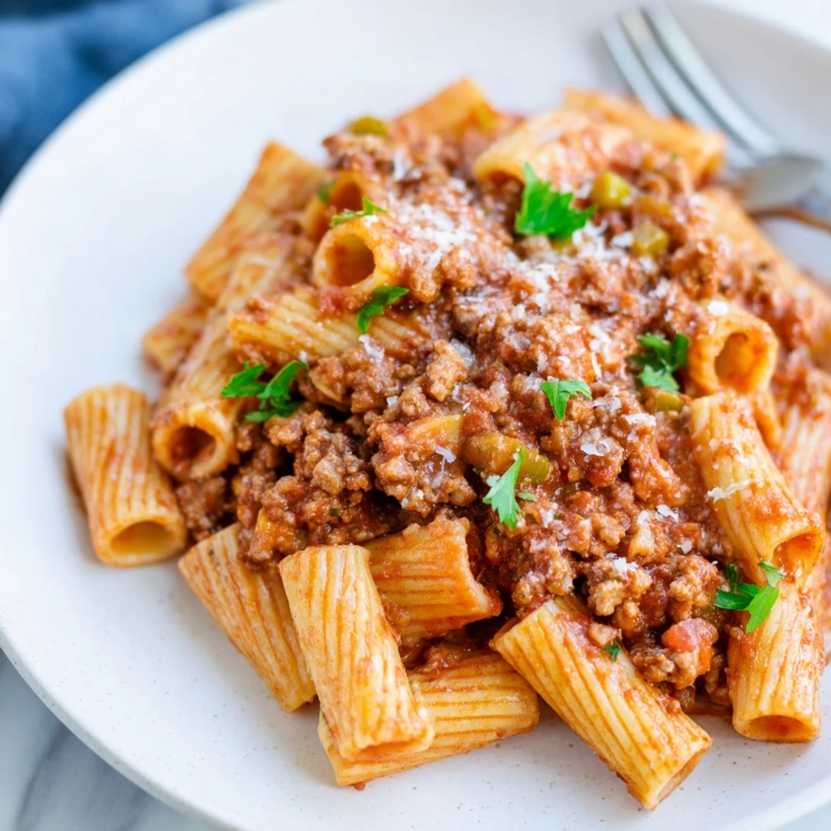 Savory ground turkey Bolognese simmered with vegetables and crushed tomatoes in a rustic bowl