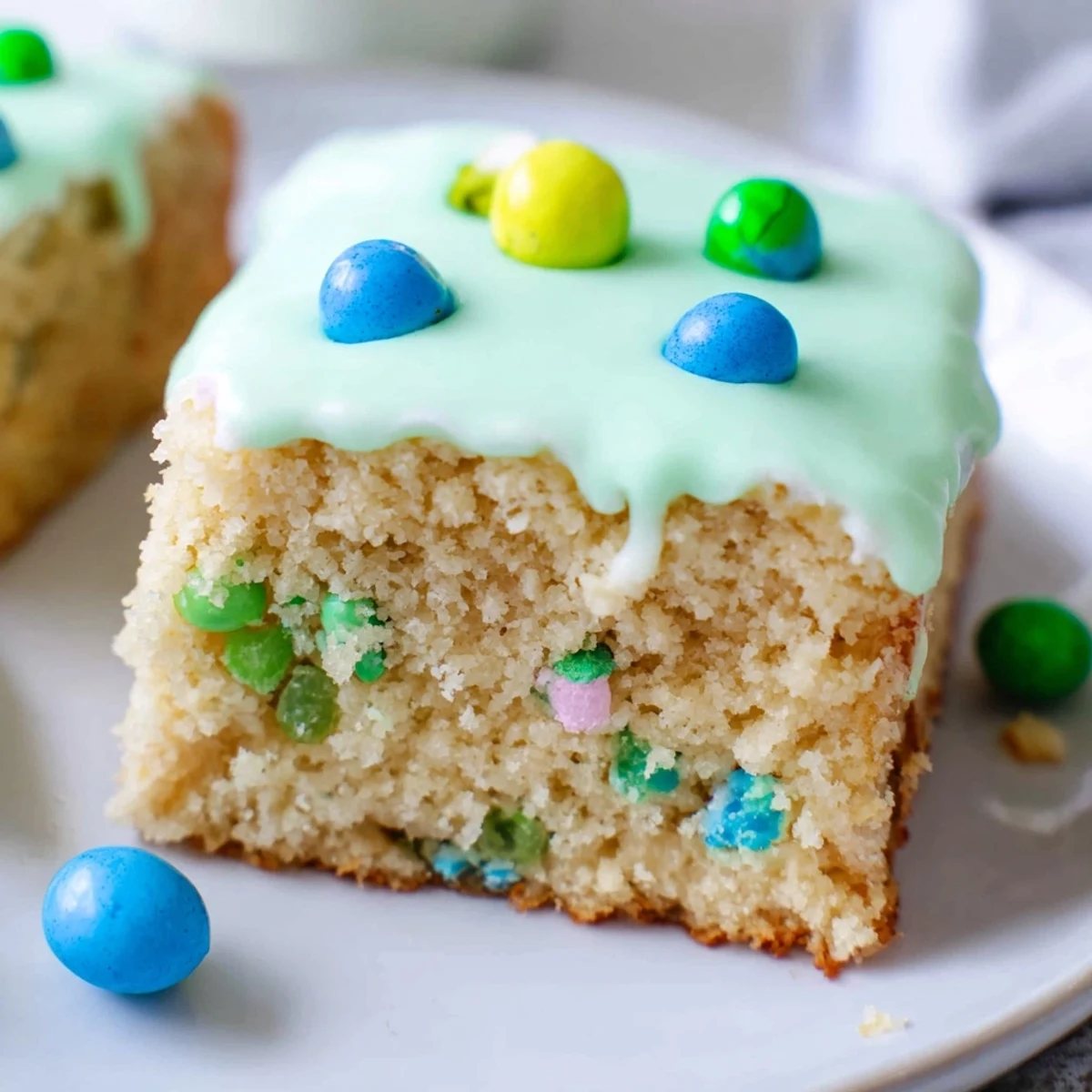 Tender vanilla robin egg snack cake drizzled with sweet blue and green icing