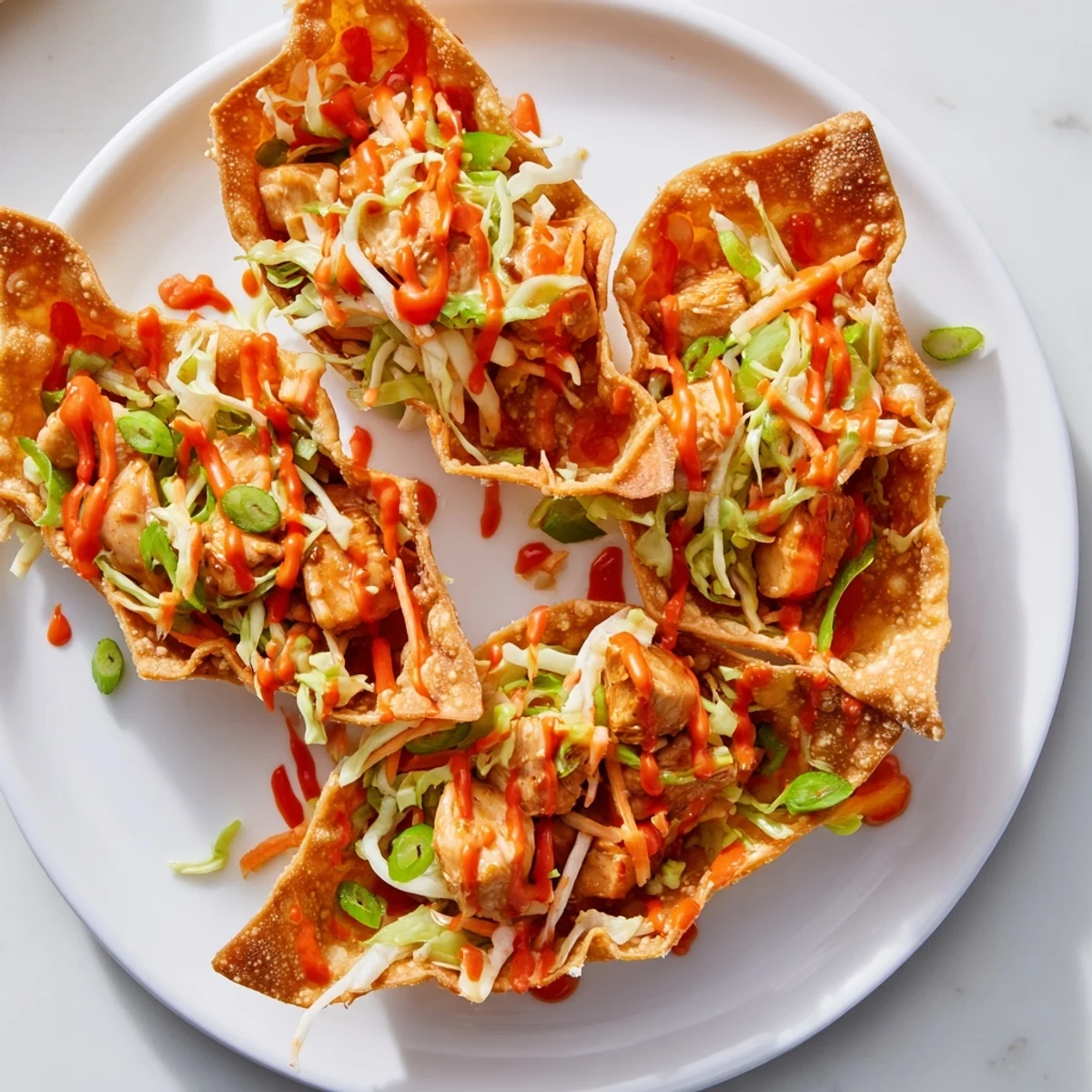 Golden crispy chicken wonton tacos filled with savory seasoned meat and colorful crunchy slaw