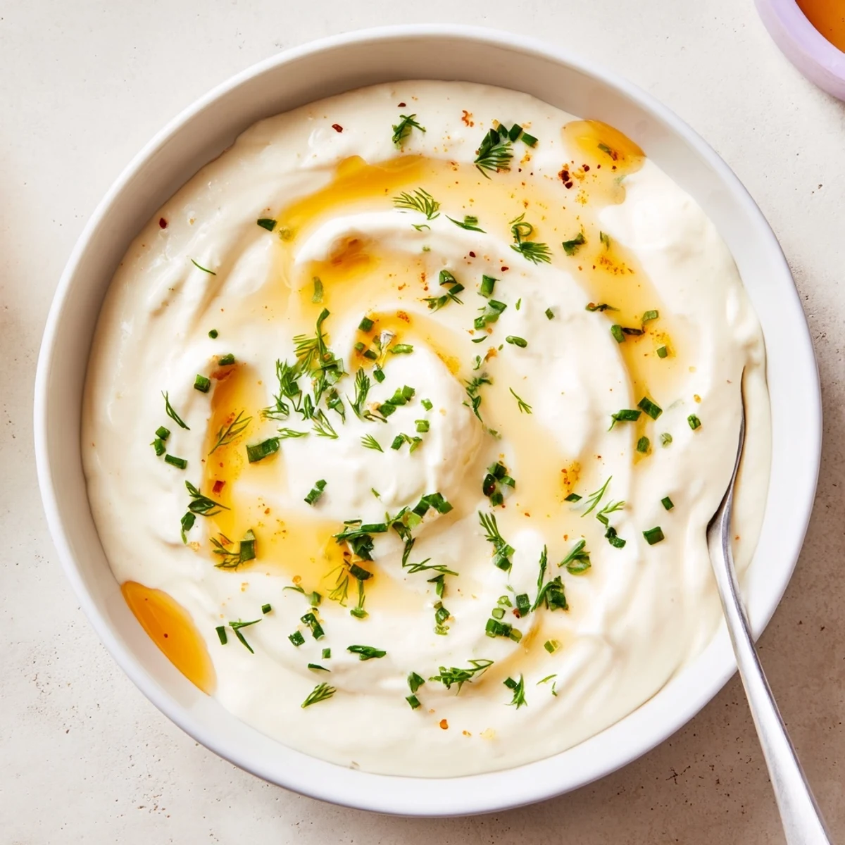 Hot Honey Ranch Dip drizzled with honey, creamy herbs, served with veggies