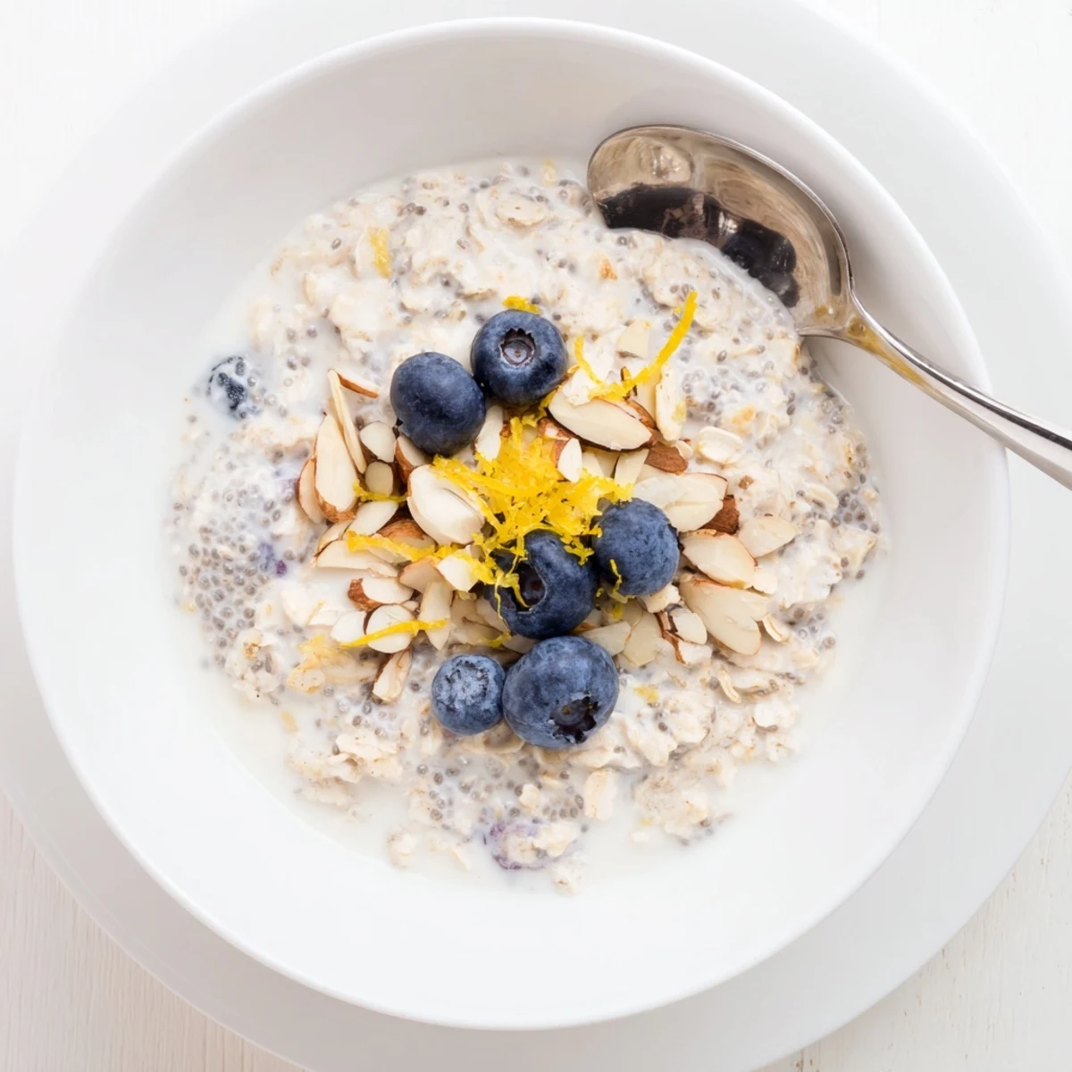 Blueberry Lemon Overnight Oats topped with fresh blueberries, bright lemon zest.