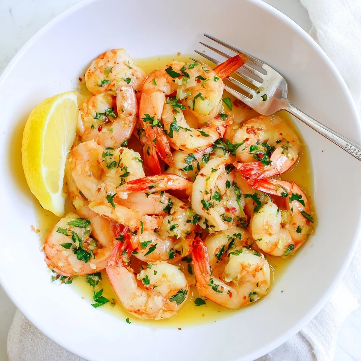 Plump buttered shrimp coated in a silky garlic butter sauce ready for serving